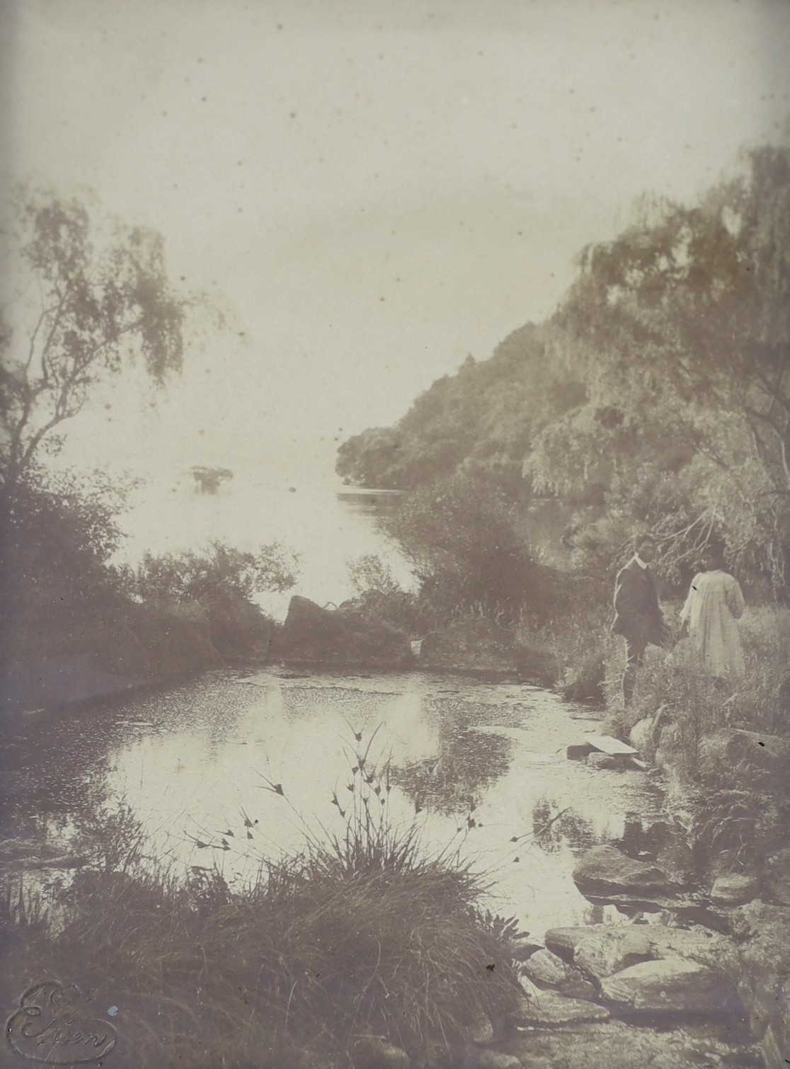 A pair of Maori carved wood photograph frames containing contemporary New Zealand photographs c.1900-10, frames 32.5 cm x 27 cm